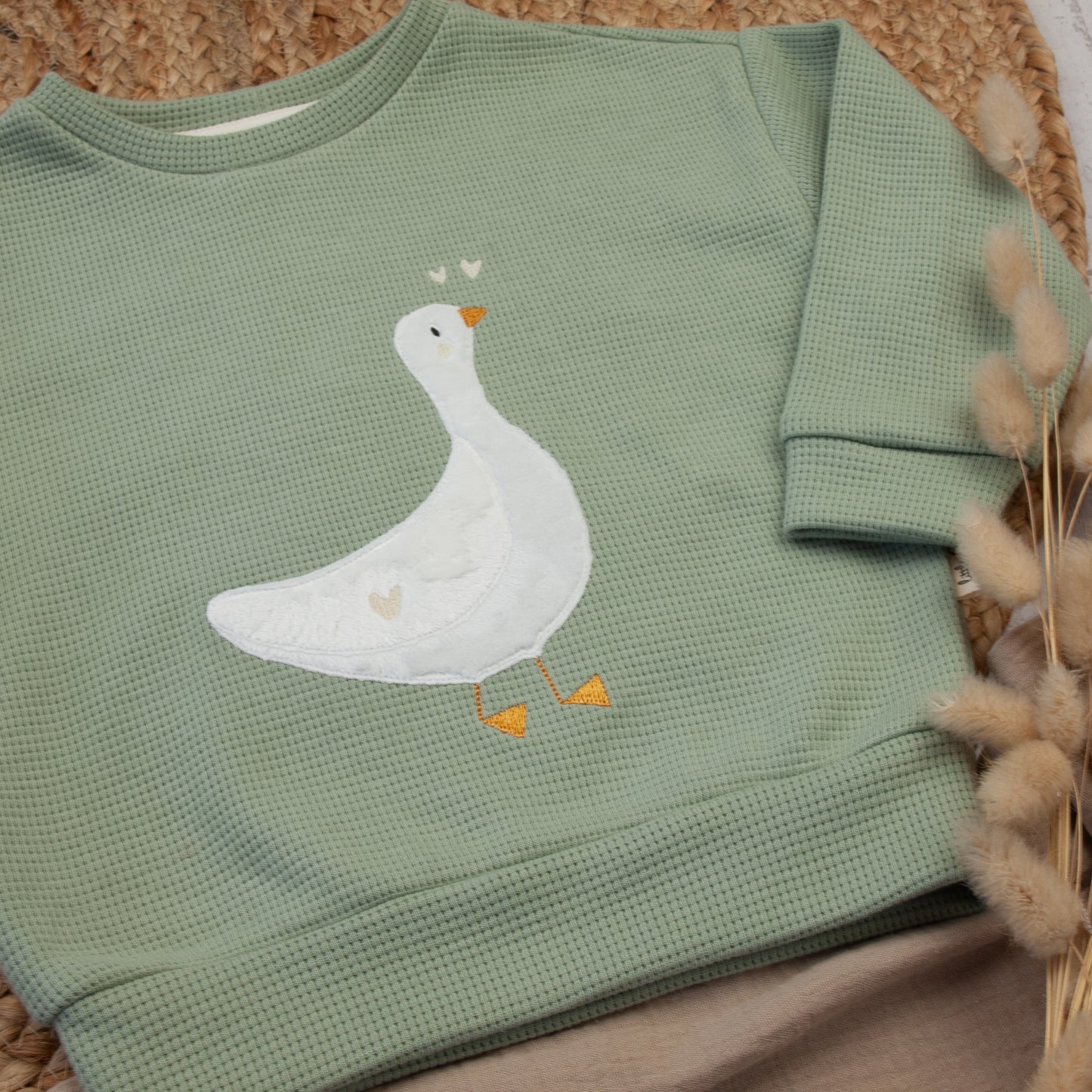 Loosefit-Pullover mit Gänse-Applikation Größe 56 bis 134 (A002A017)